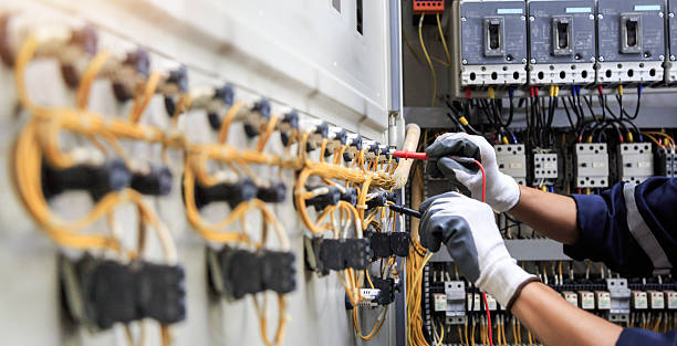 Professional Electrician technician working in Woodville, AL